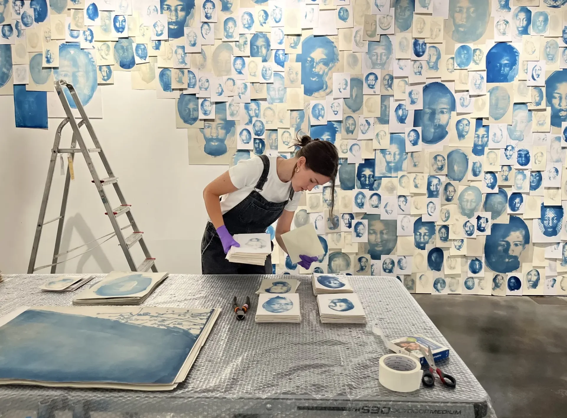 Careful deinstall of Eric Gyamfi exhibition